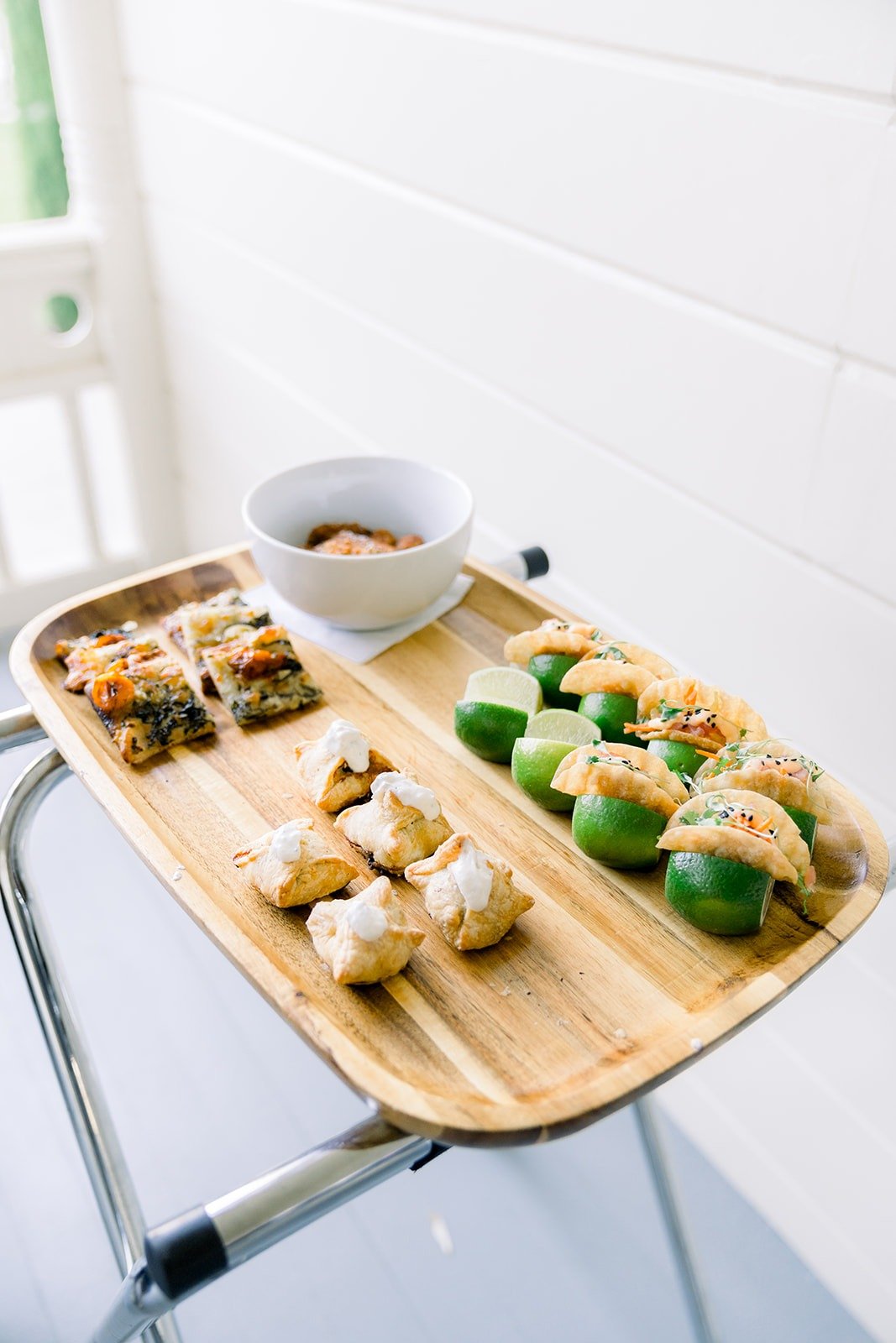 Appetizers served on a wooden board, photographed by One and Only Production