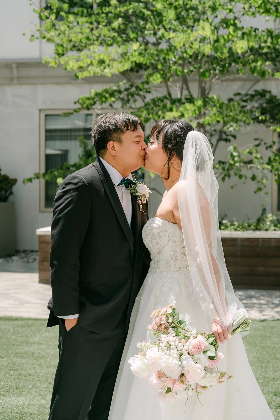 James kissing Stella in the courtyard at the Sheraton, photographed by One and Only Production
