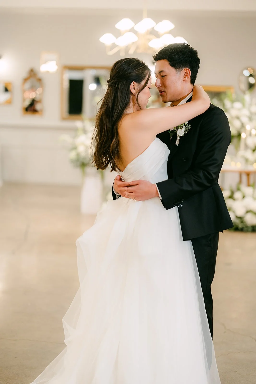 Jadee and Richard embracing during their first dance