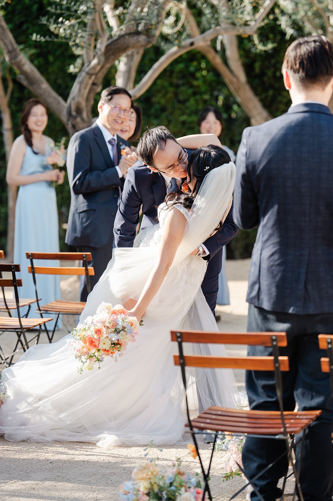 Lawrence dipping Constance for a kiss in the aisle