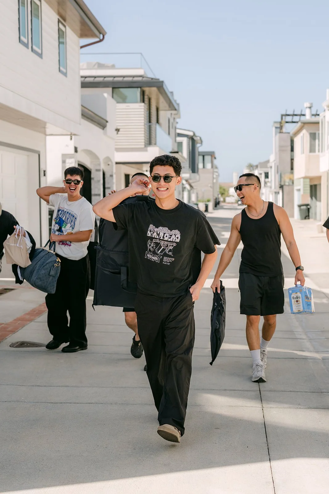 Richard and his groomsmen walking a Newport Beach street on game day