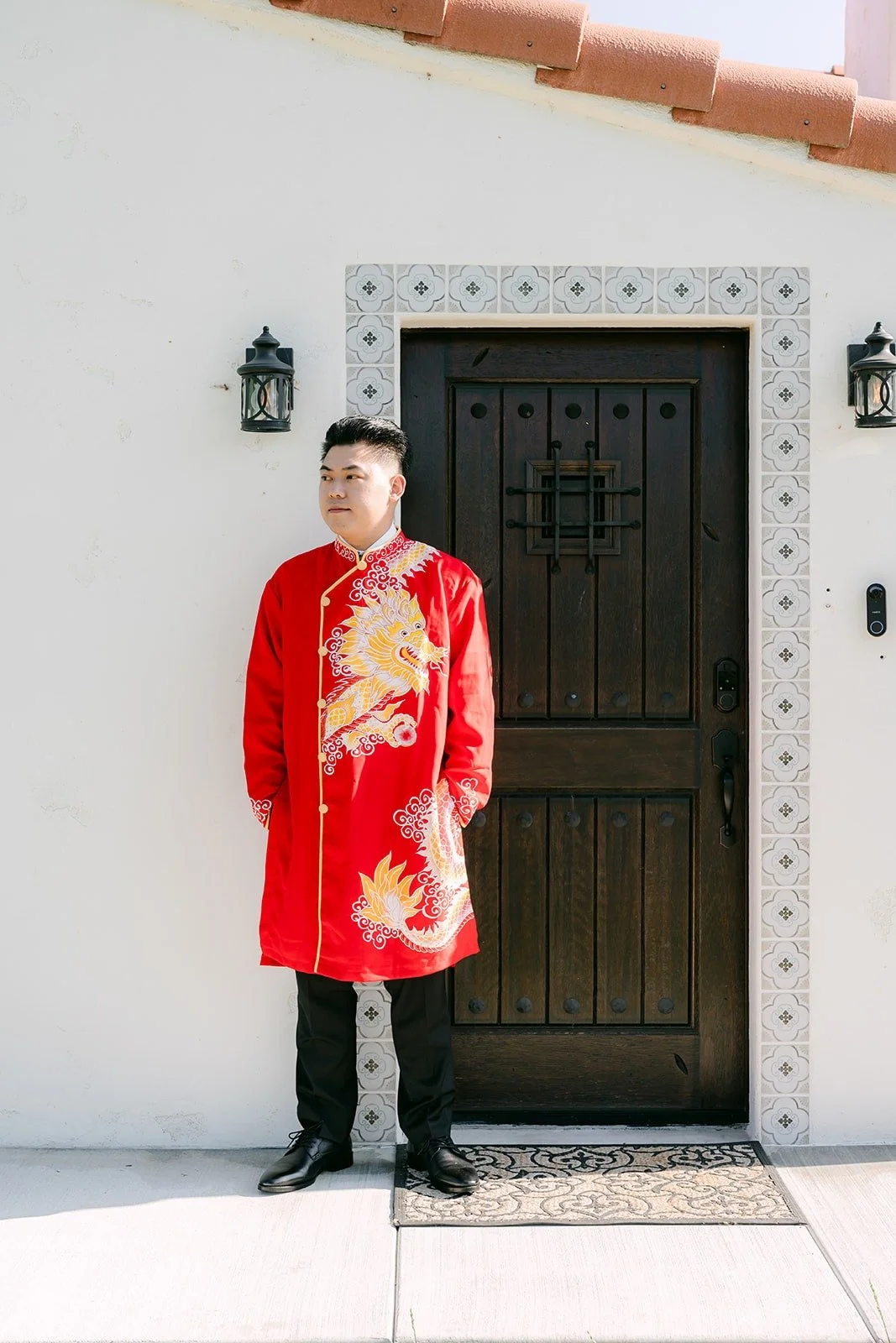 Vincent in his red embroidered jacket at the front door