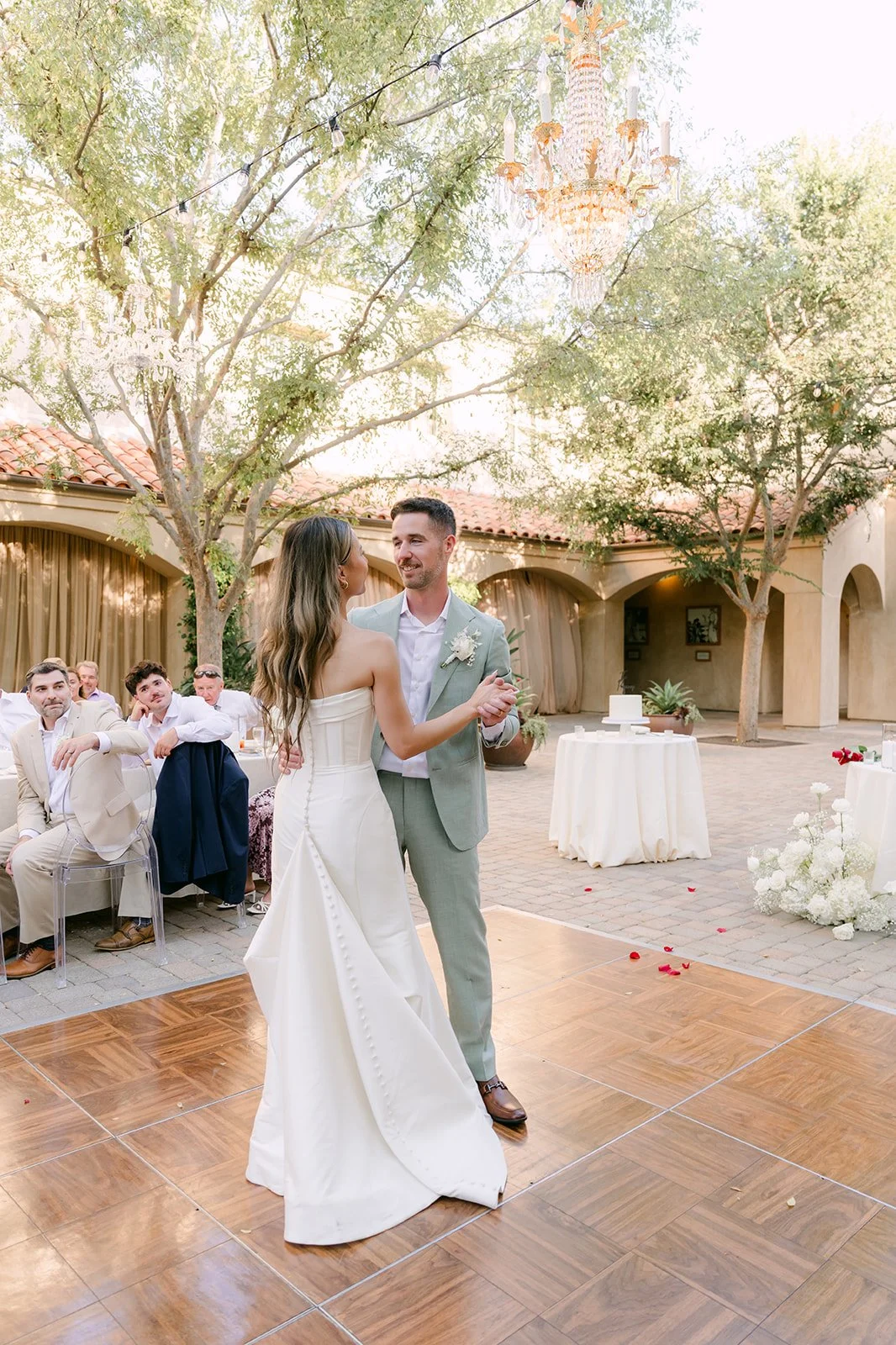 Couple's first dance on the wood dance floor to Forever by Noah Kahan