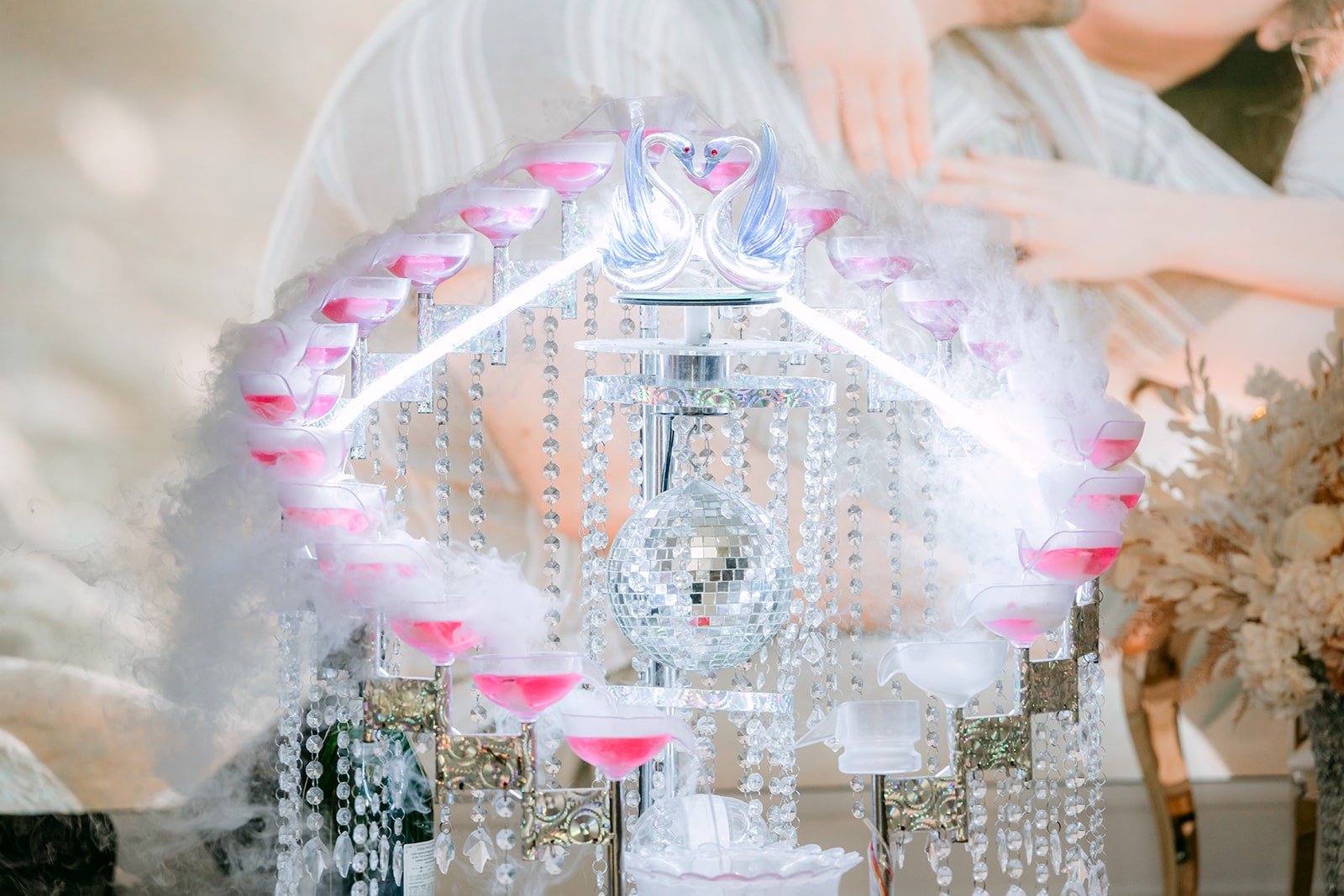 Close up of the crystal champagne display glowing with pink light