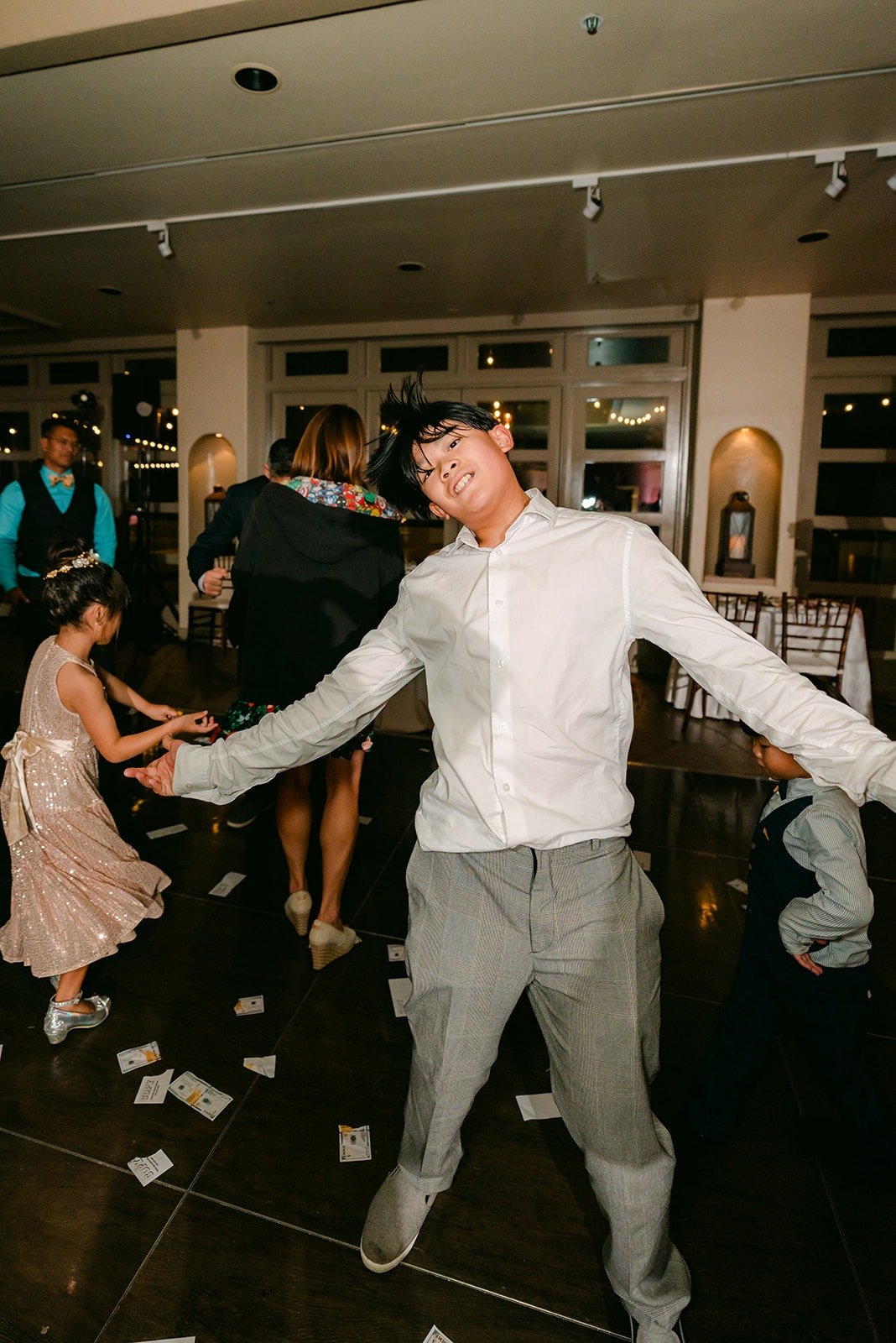 A guest dancing in the middle of the floor, photographed by One and Only Production