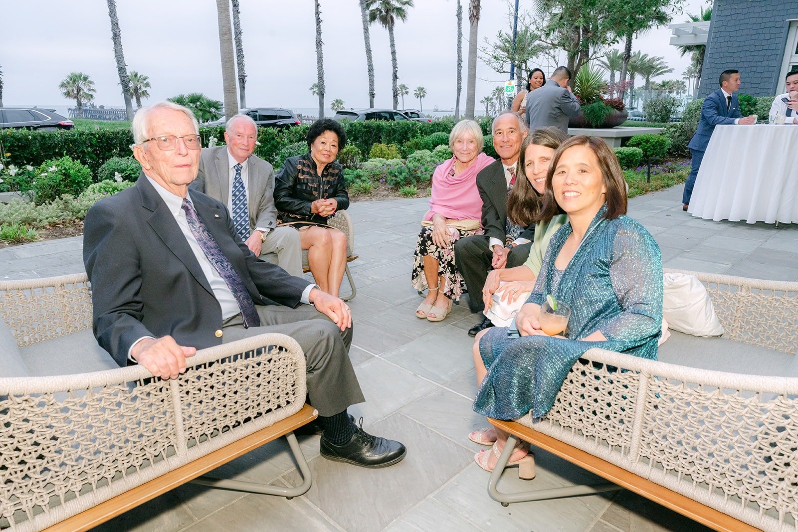 Guests relaxing on the terrace seating during cocktail hour