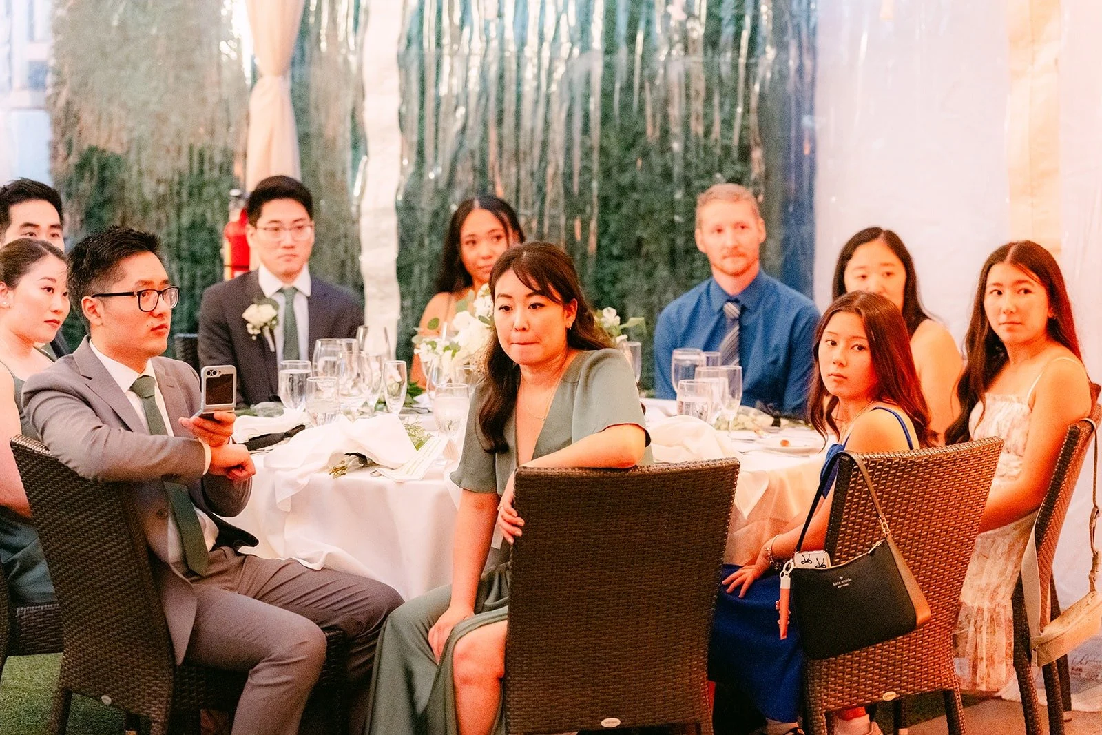 Guests smiling as they watch the first dance