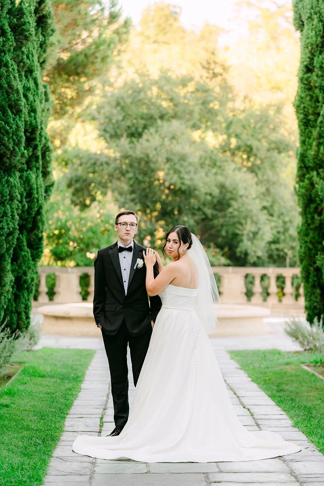 Brianna and Nik at the end of the cypress allee
