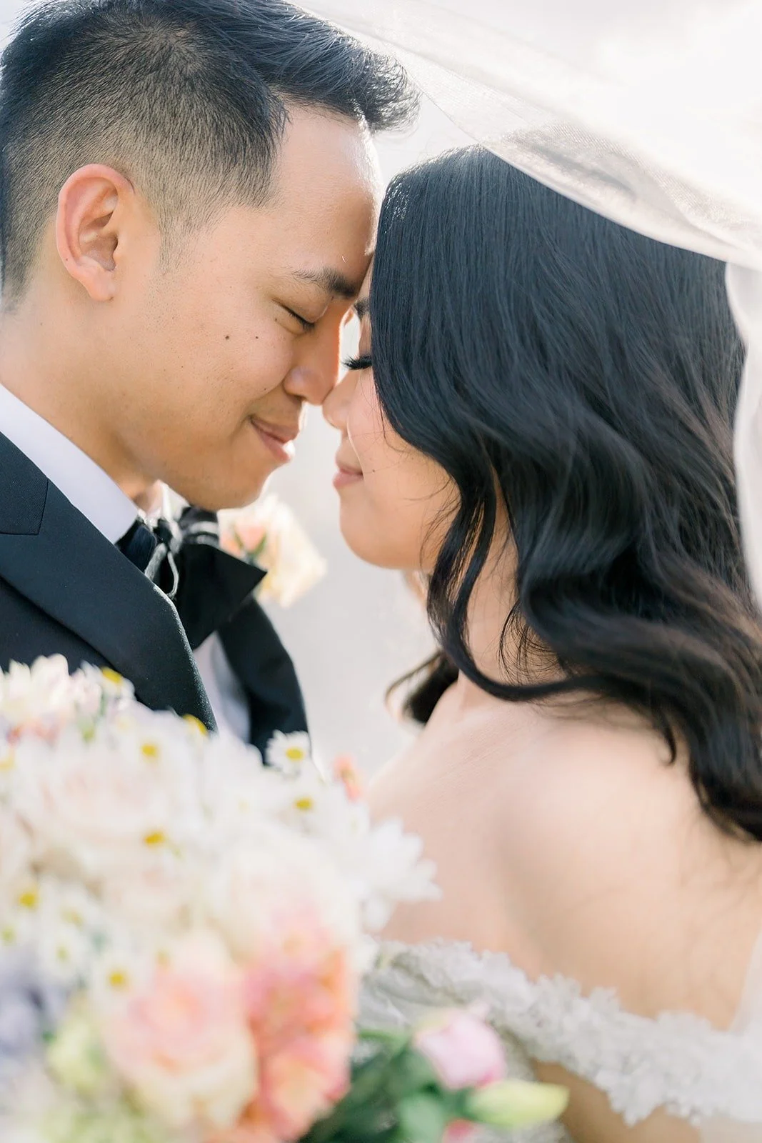 Close portrait of Francesca and Ralph touching foreheads
