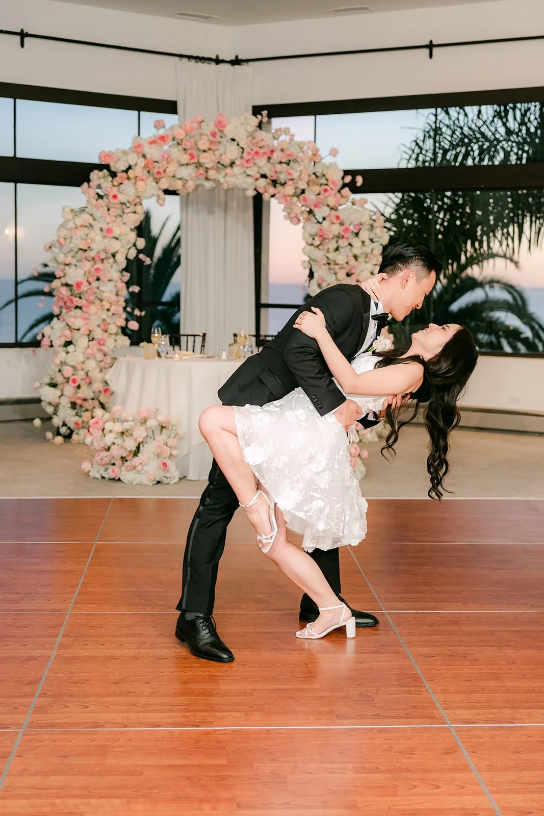 Groom dipping the bride during their first dance