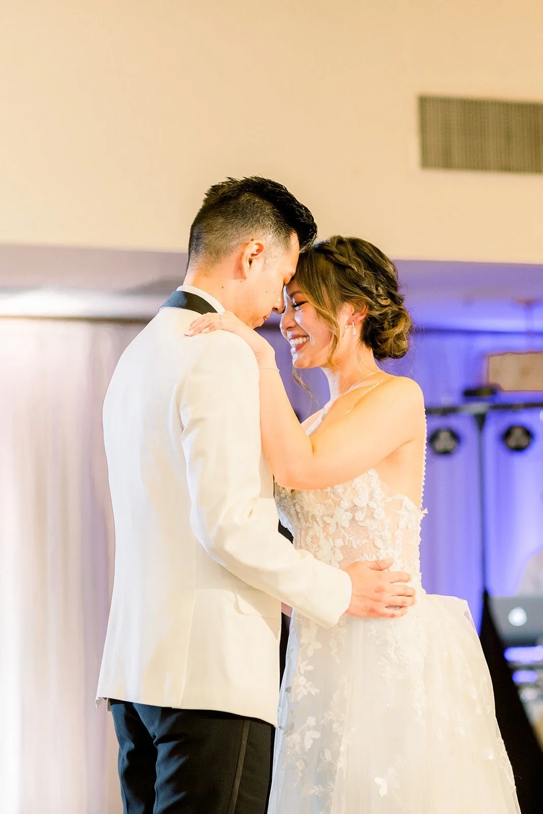 Josephine and David slow dancing under the lights