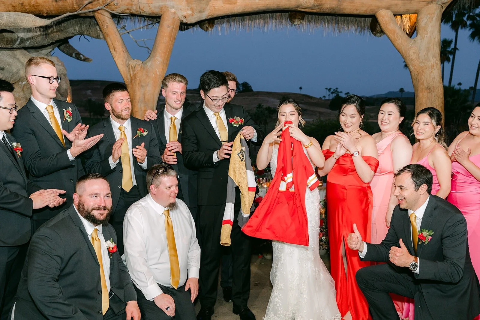 The wedding party cheering during the jersey swap