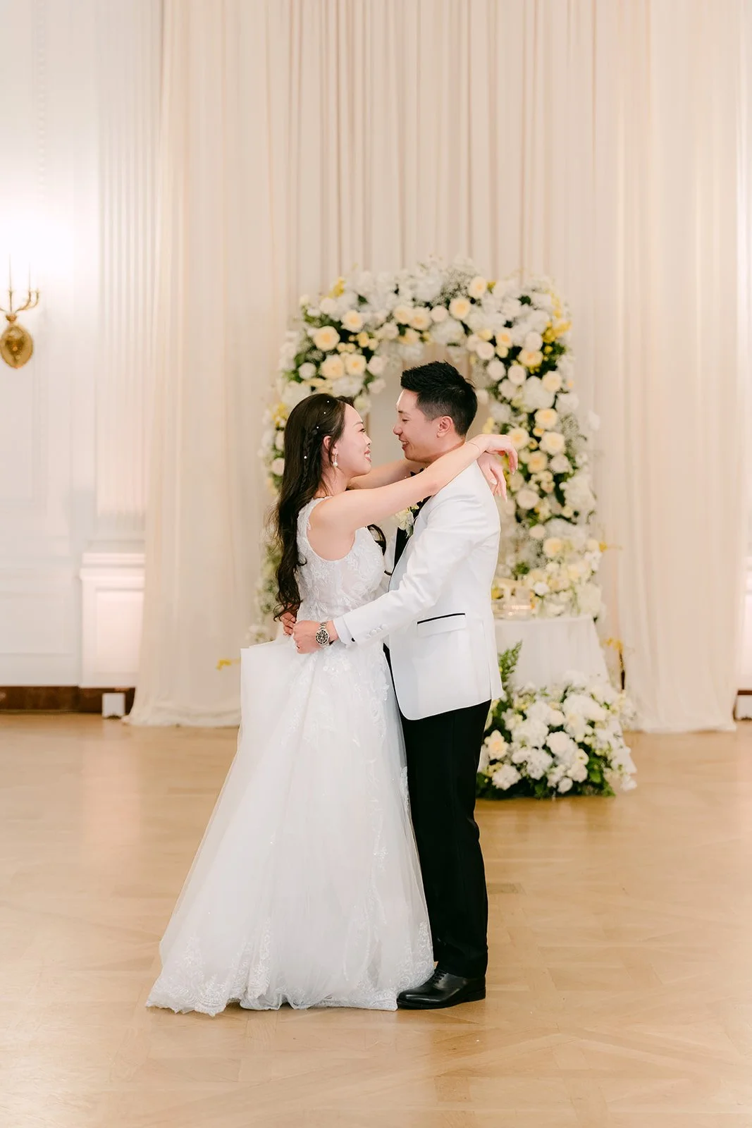 Jenny and Ryan embracing during their first dance.