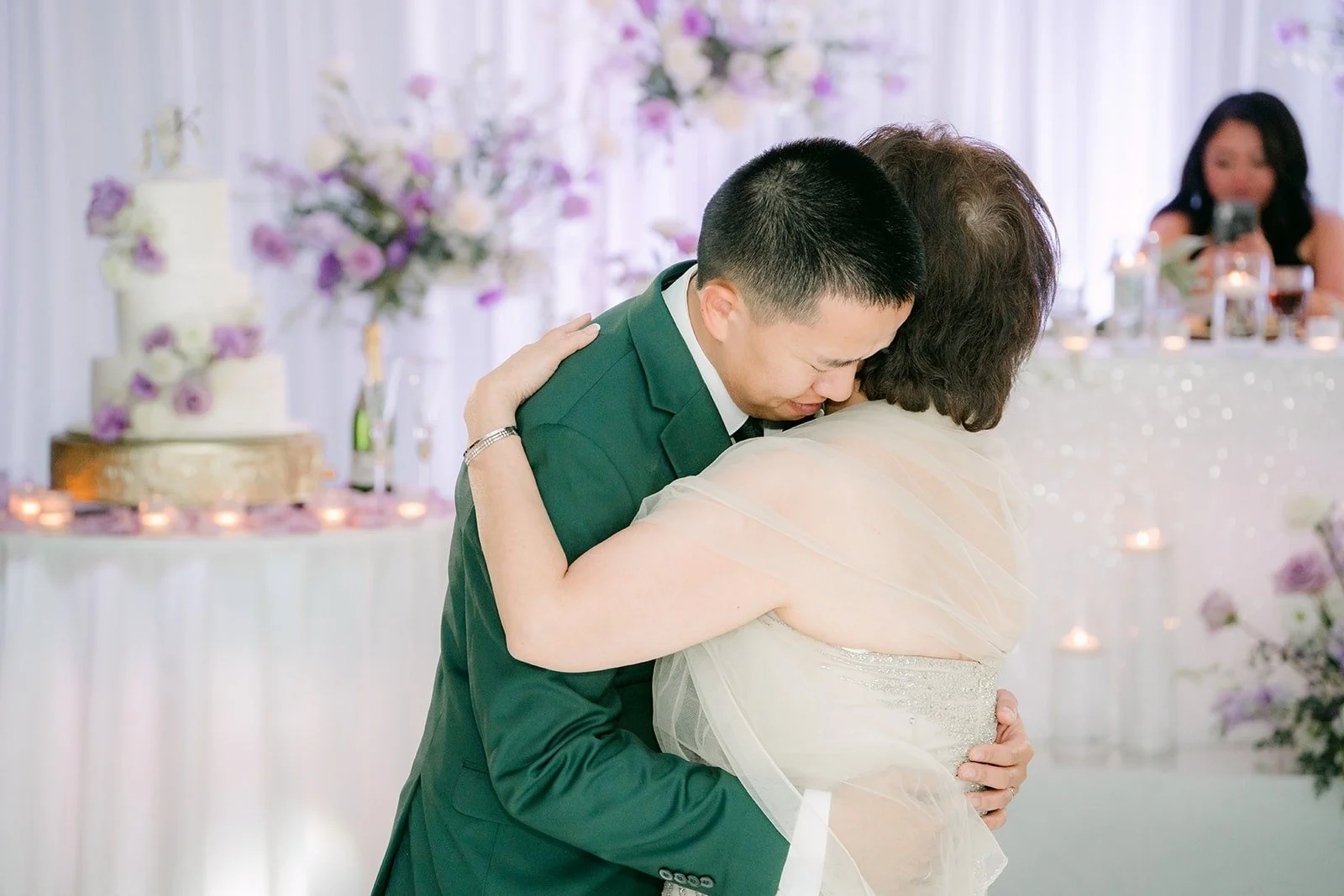 Kevin hugs a family member during the parent dances