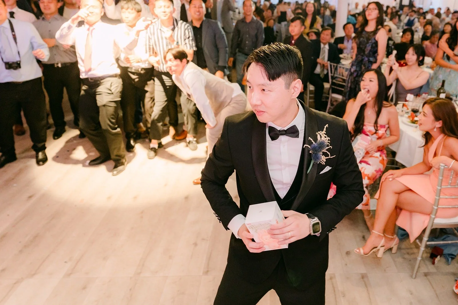 James laughing as guests scramble for the Labubu