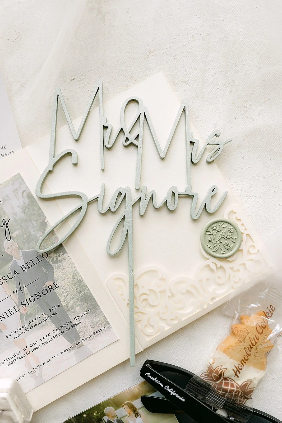 Acrylic Mr and Mrs Signore sign beside a wax sealed invitation for Francesca and Daniel's wedding