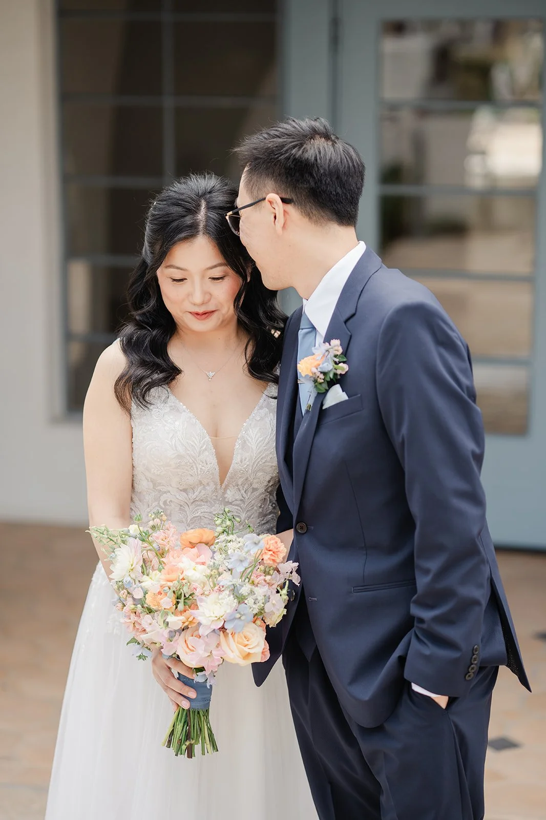 Couple leaning in close after their first look