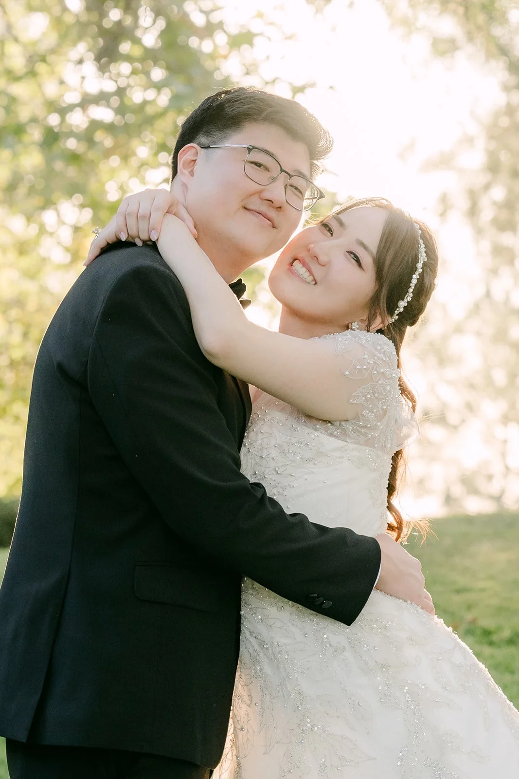 Judy and Joshua close together in golden light