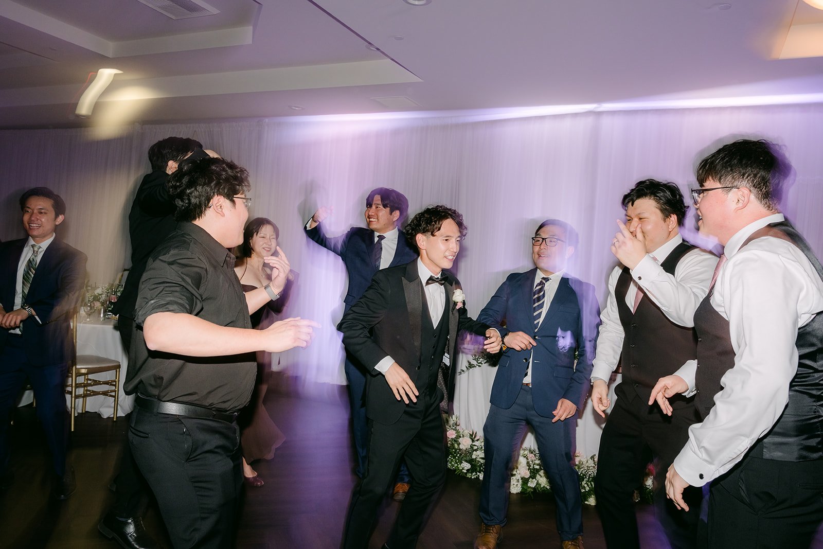 Groomsmen dancing during open dancing at Vellano Estate