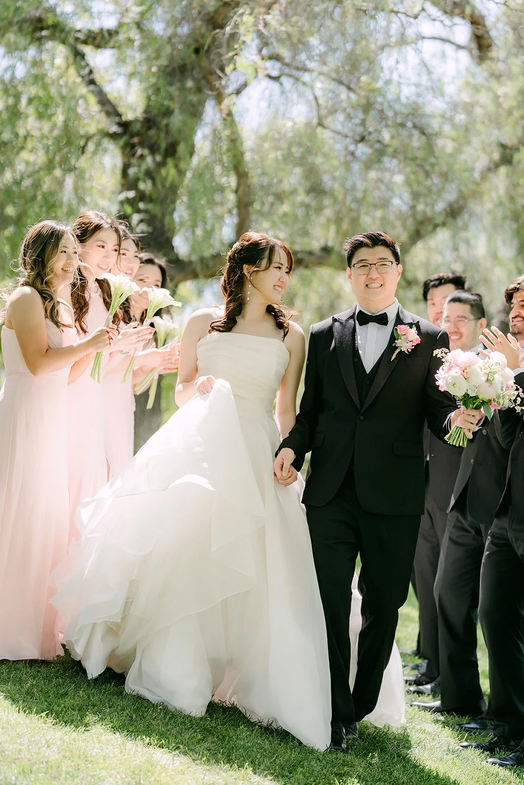 The wedding party walking together