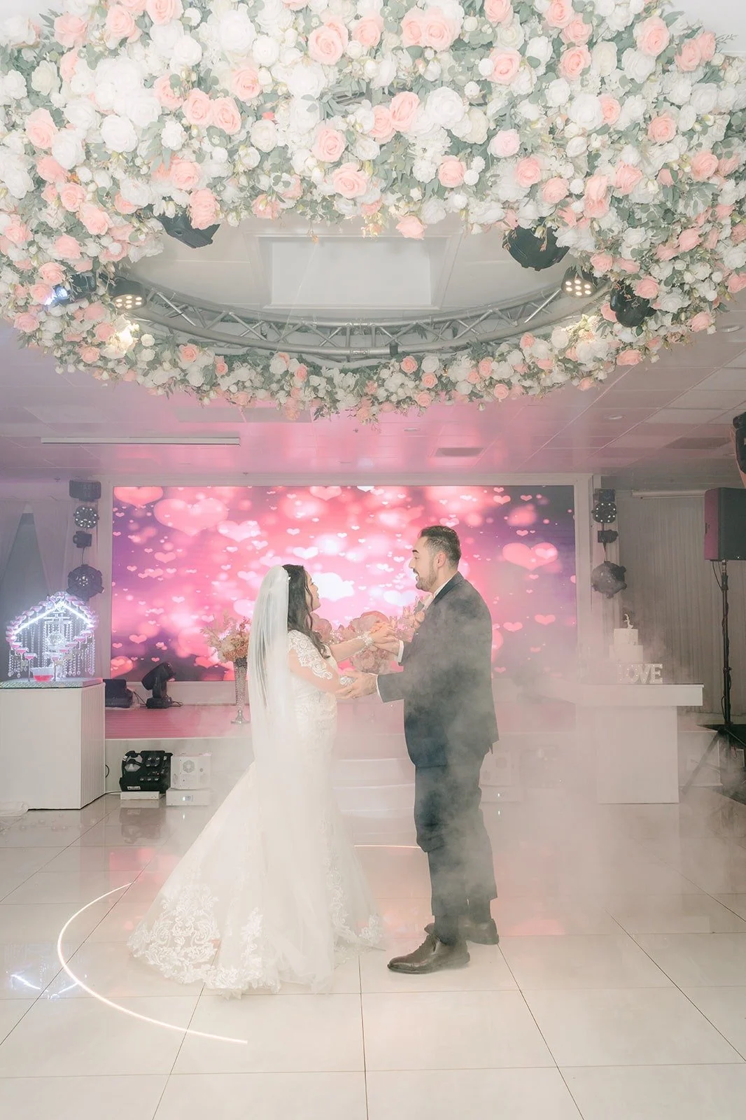 Amy and James dancing in a cloud of fog, photographed by One and Only Production