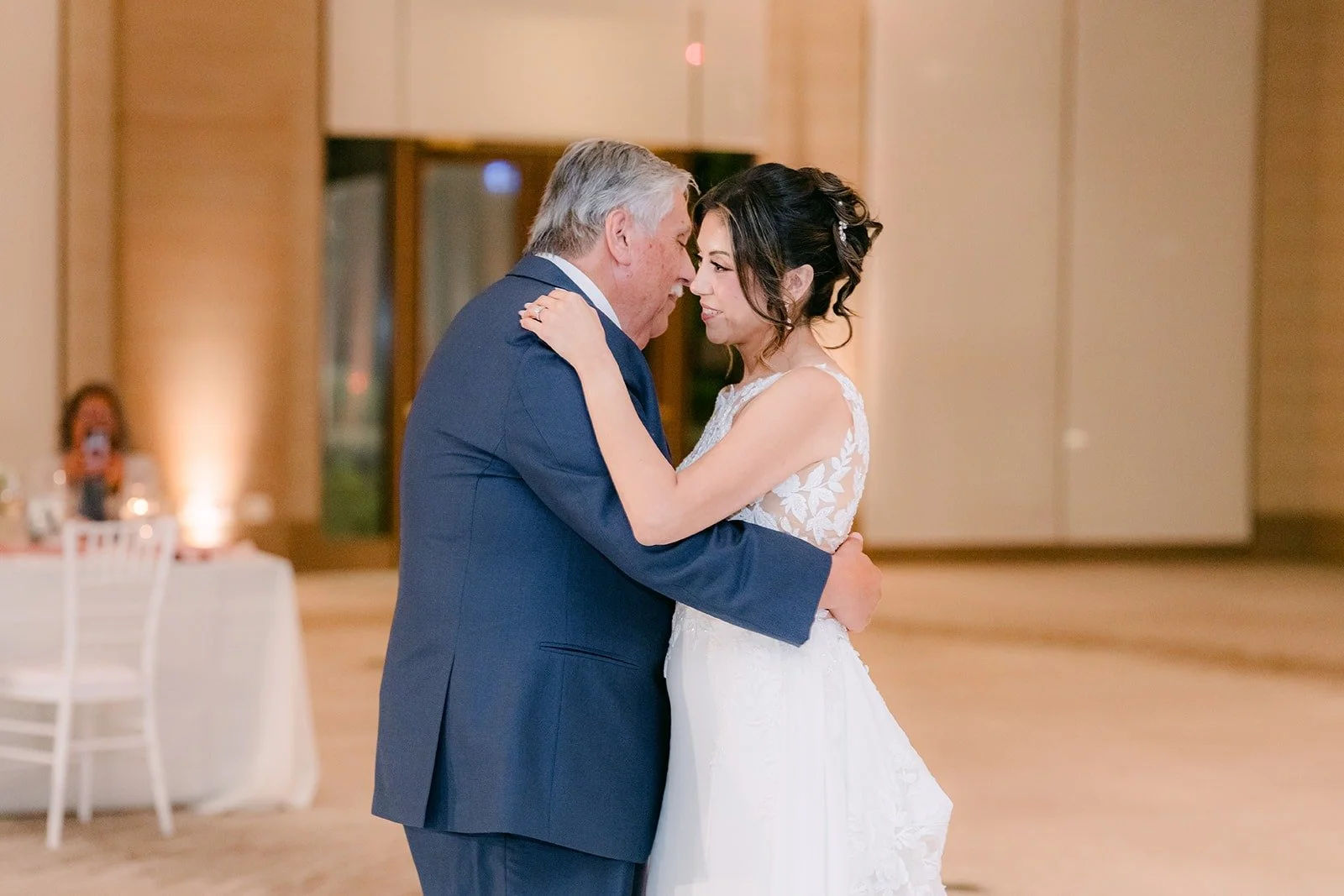 Francesca and her father share a tender moment on the dance floor