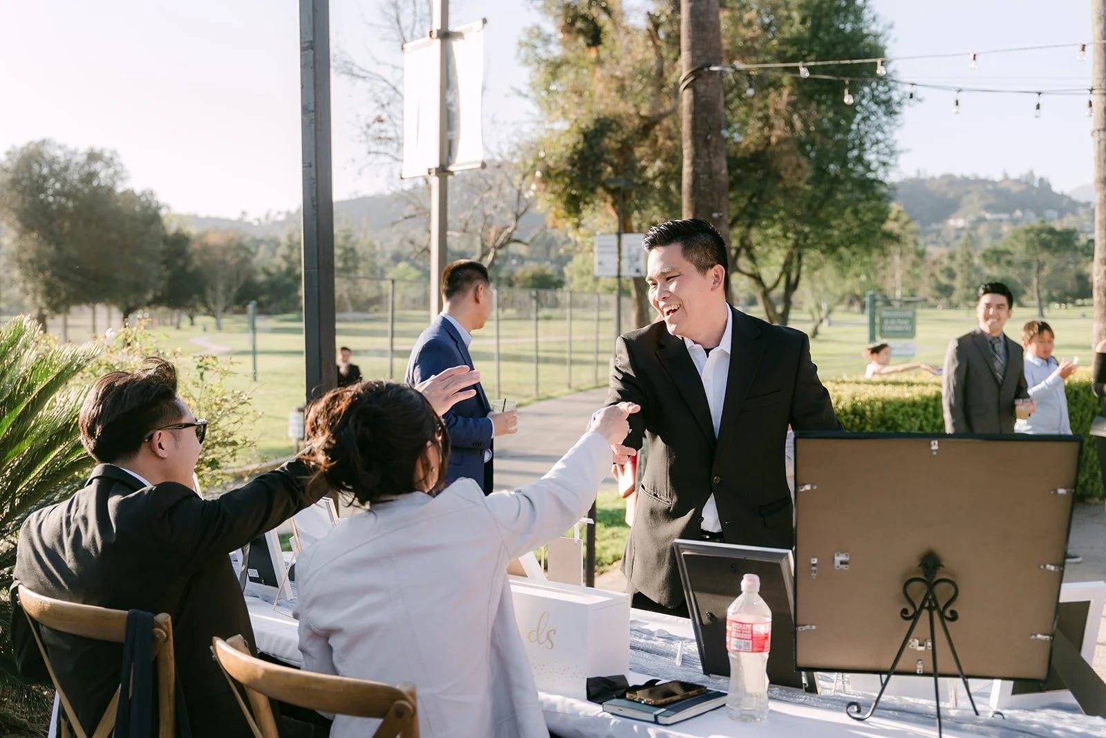 Guests mingling on the terrace during cocktail hour