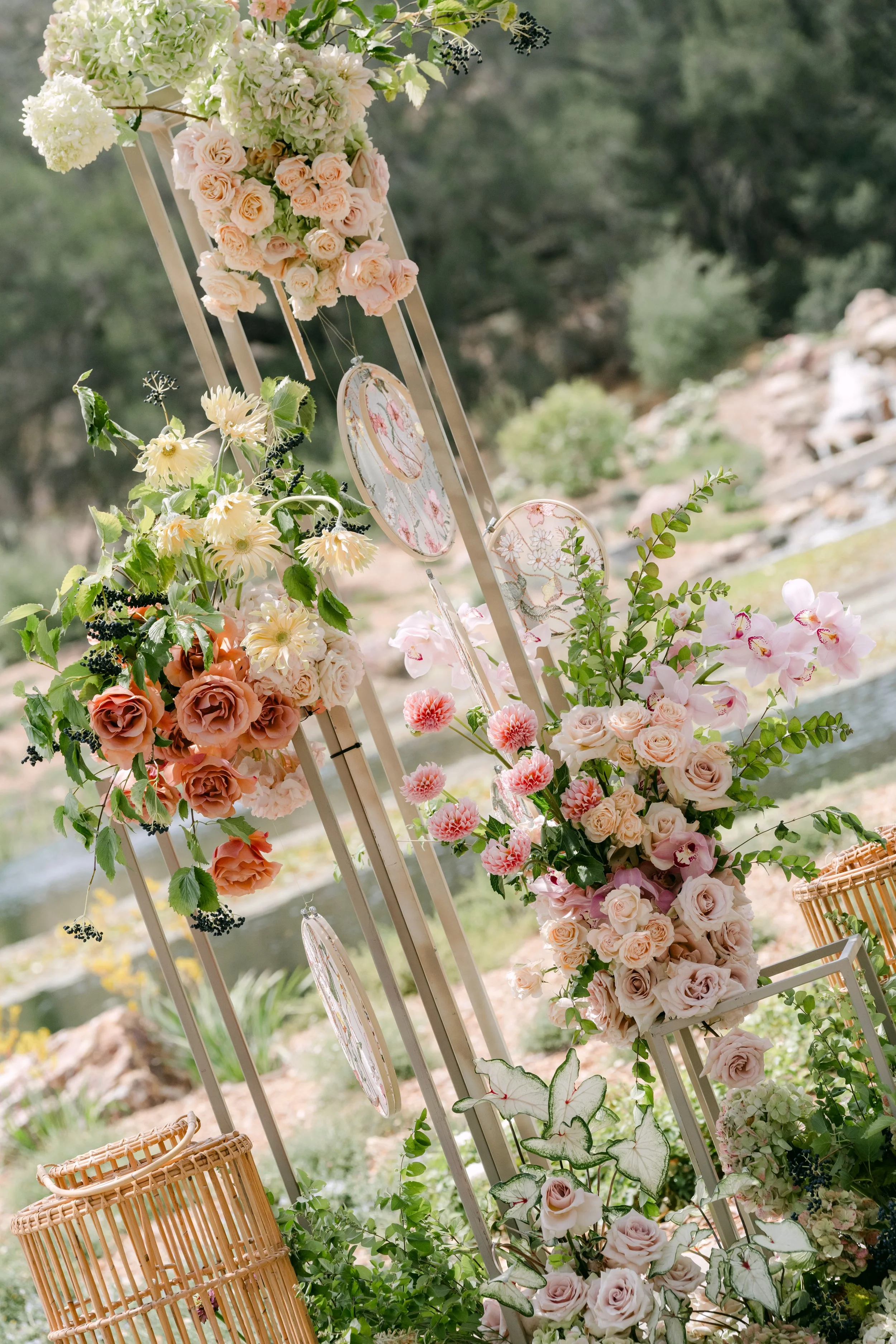 Ceremony arch with peach and blush roses at Monserate Winery in Fallbrook