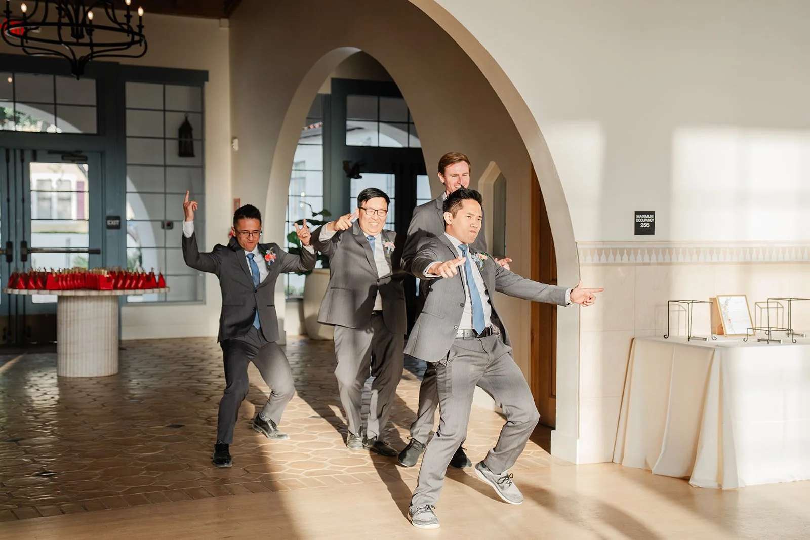 Groomsmen dancing into Grand Central