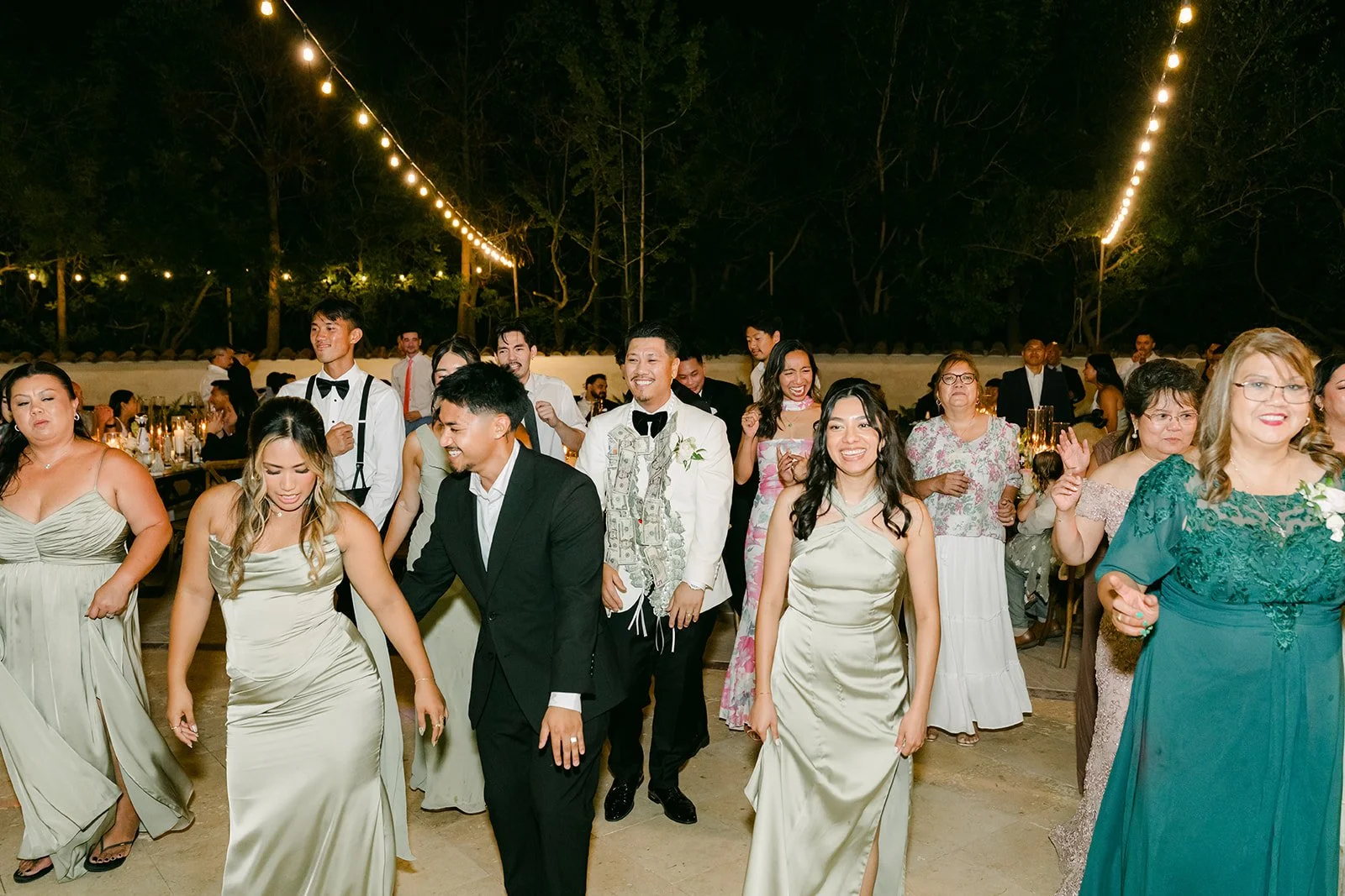 A packed dance floor of friends and family at Nicole and Caryl's reception.
