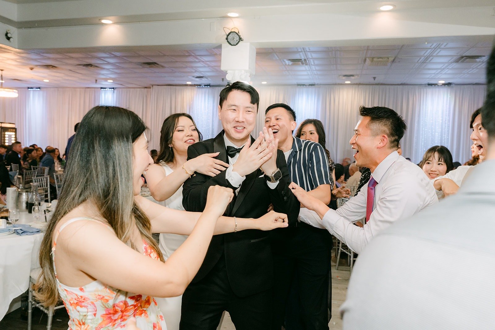 Friends dancing with Emily on the dance floor