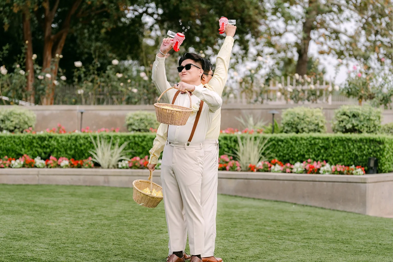 The beer boy celebrating at the end of the aisle with his basket.