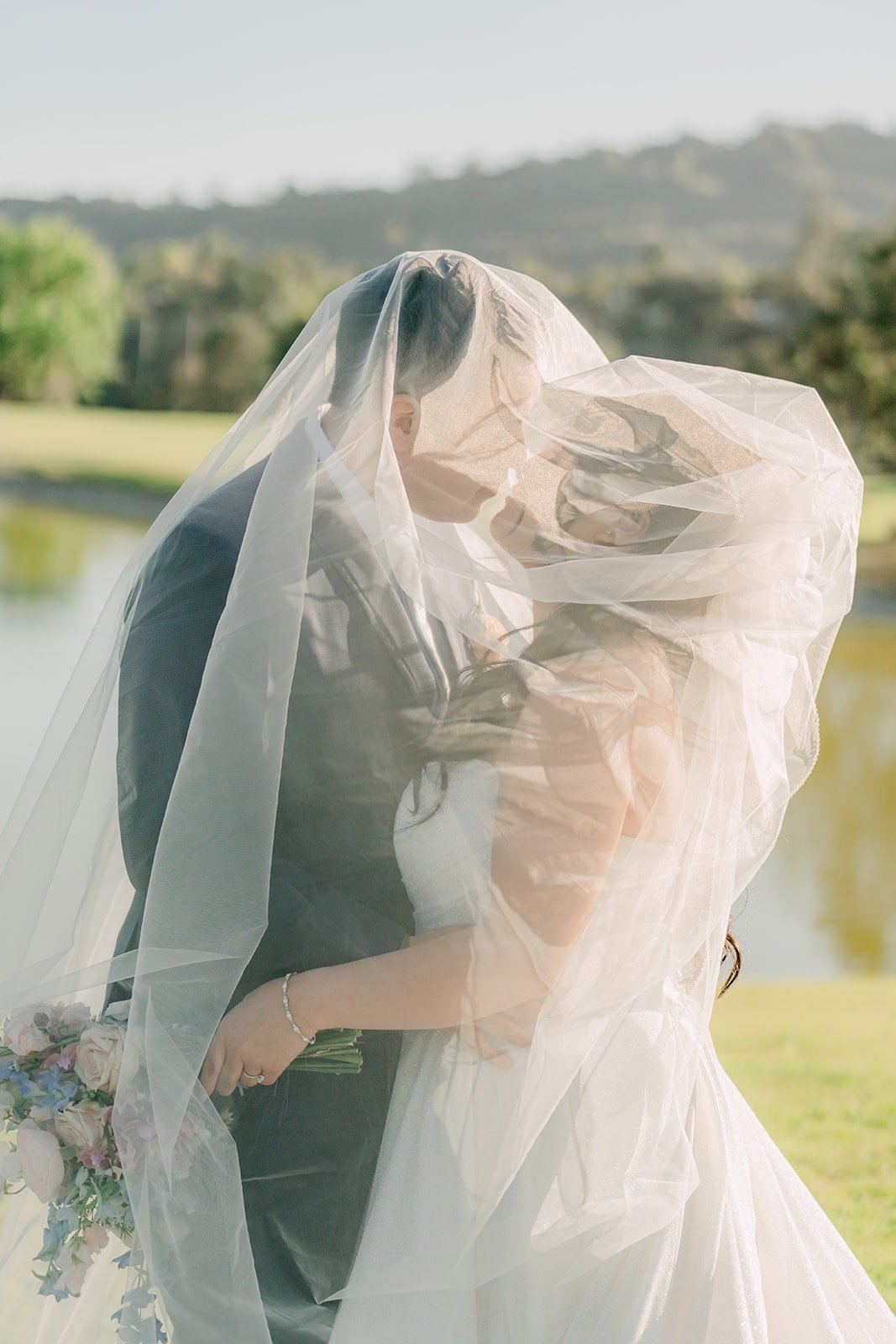 Florence's veil blowing around her and Jordan