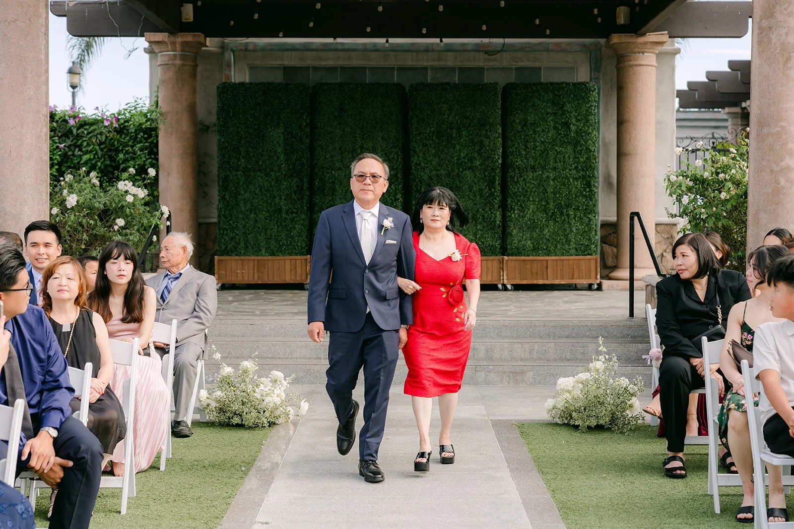 Parents walking down the aisle