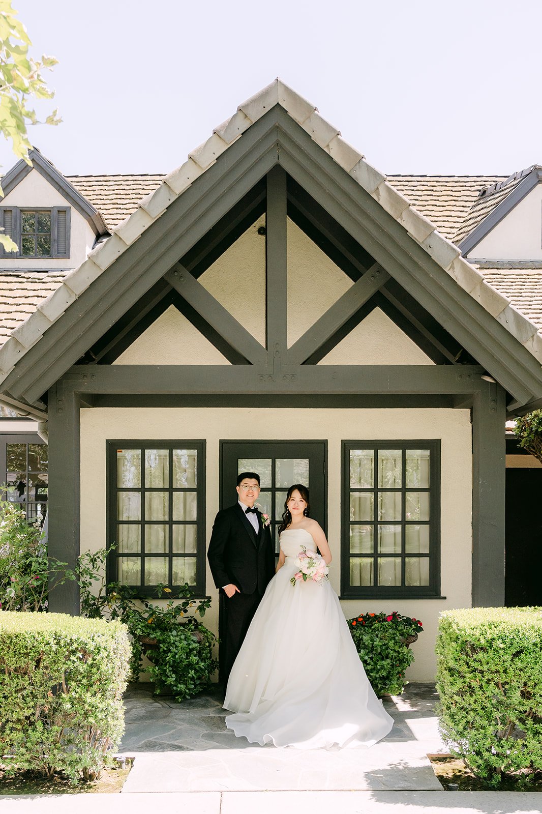 Judy and Joshua in front of the English manor