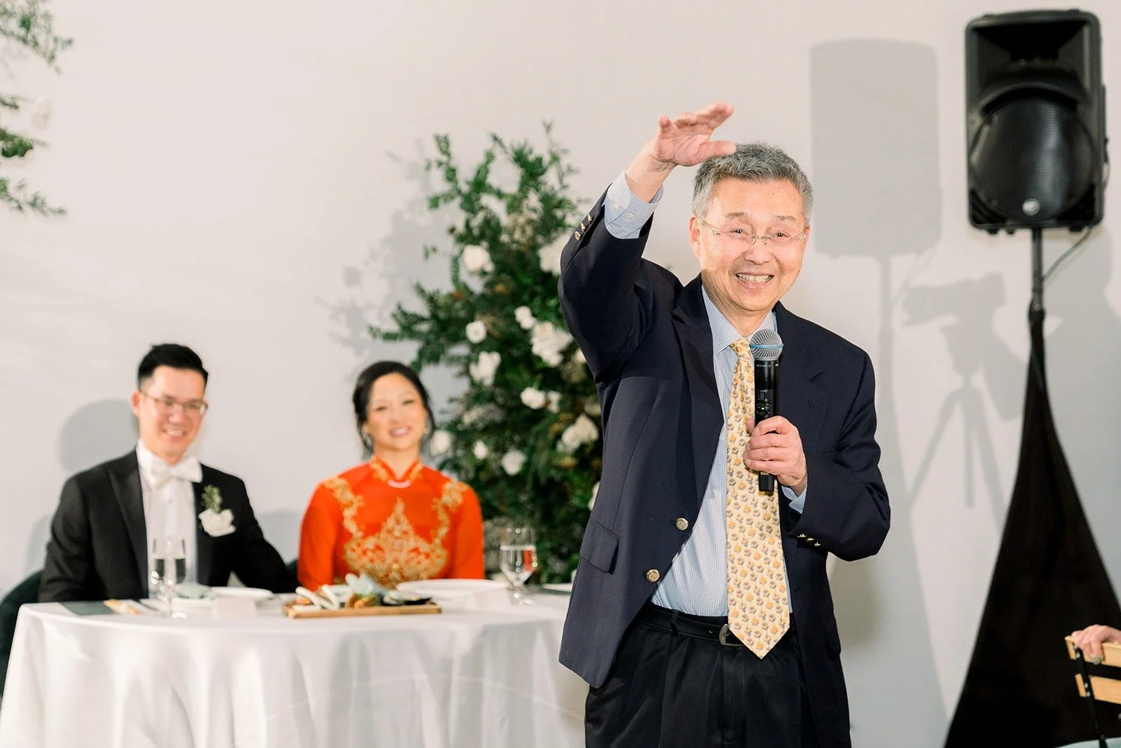 A family member raises a glass during a toast