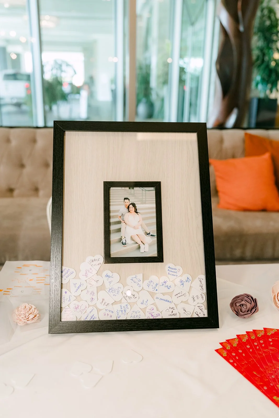 Framed guestbook with a photo of Mai and Bobby.
