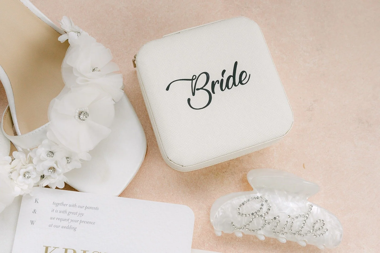 A ring dish marked Bride with pearl hair pins and earrings