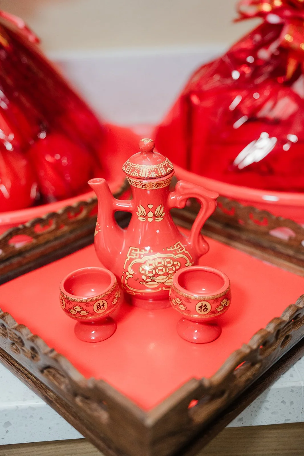 A red tea set on a tray ready for the tea ceremony.