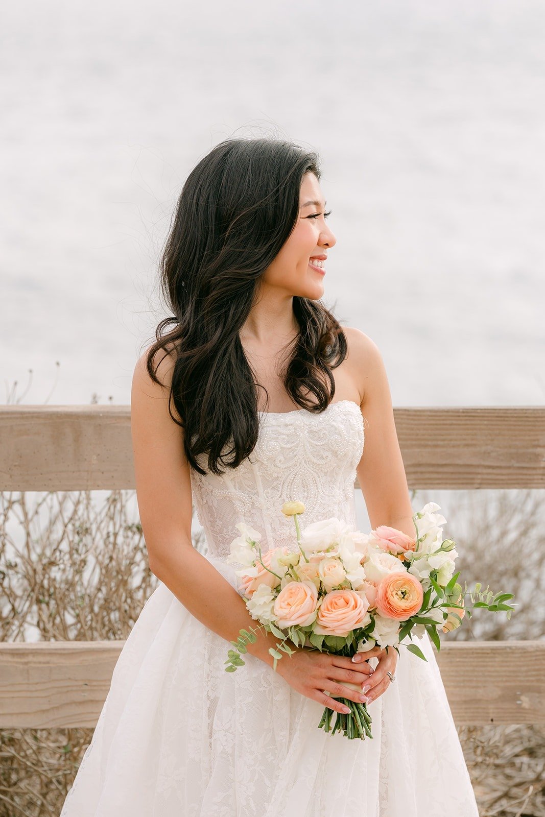 Kim with her bouquet on the bluff at Point Vicente