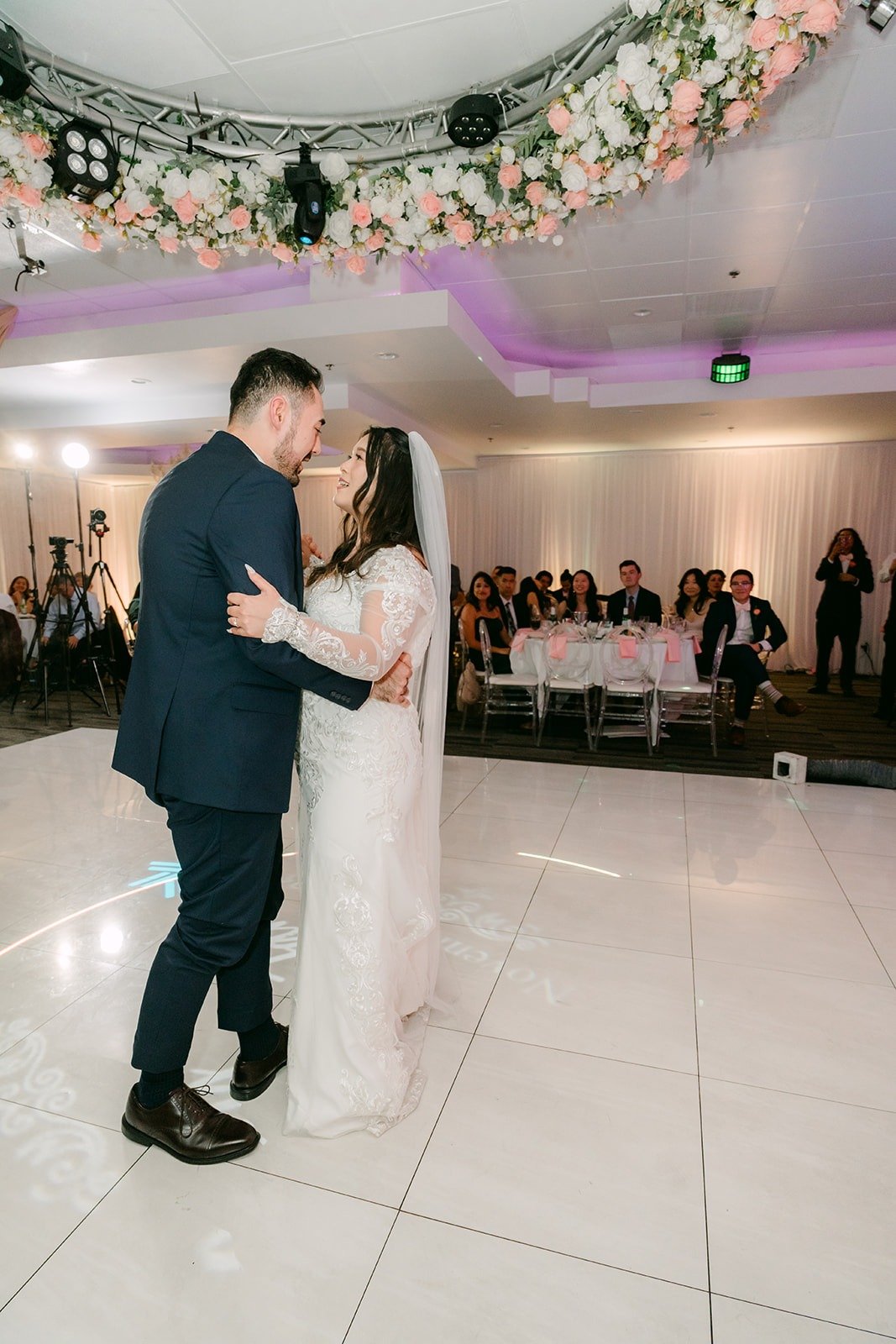 Amy and James's first dance on the white dance floor