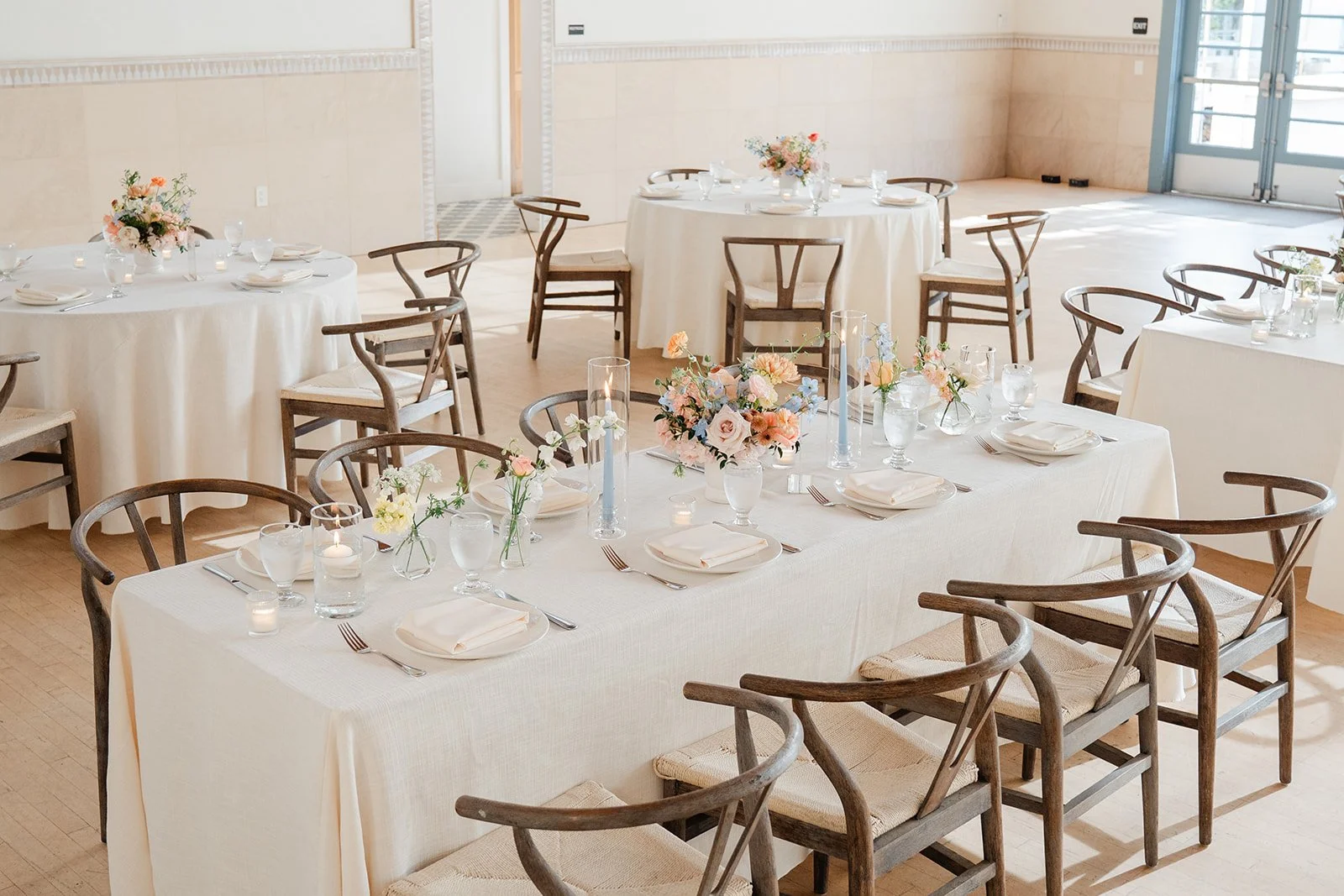 Long tables with wishbone chairs in Grand Central