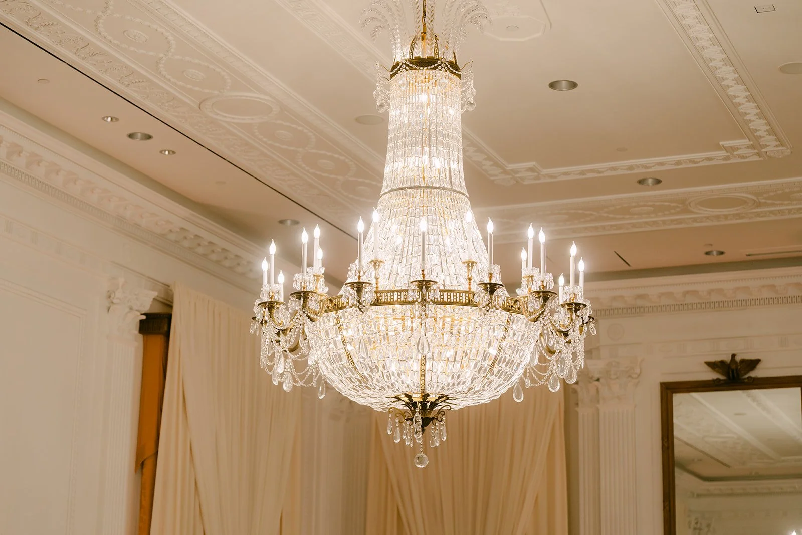 Close-up of a crystal chandelier in the reception ballroom.