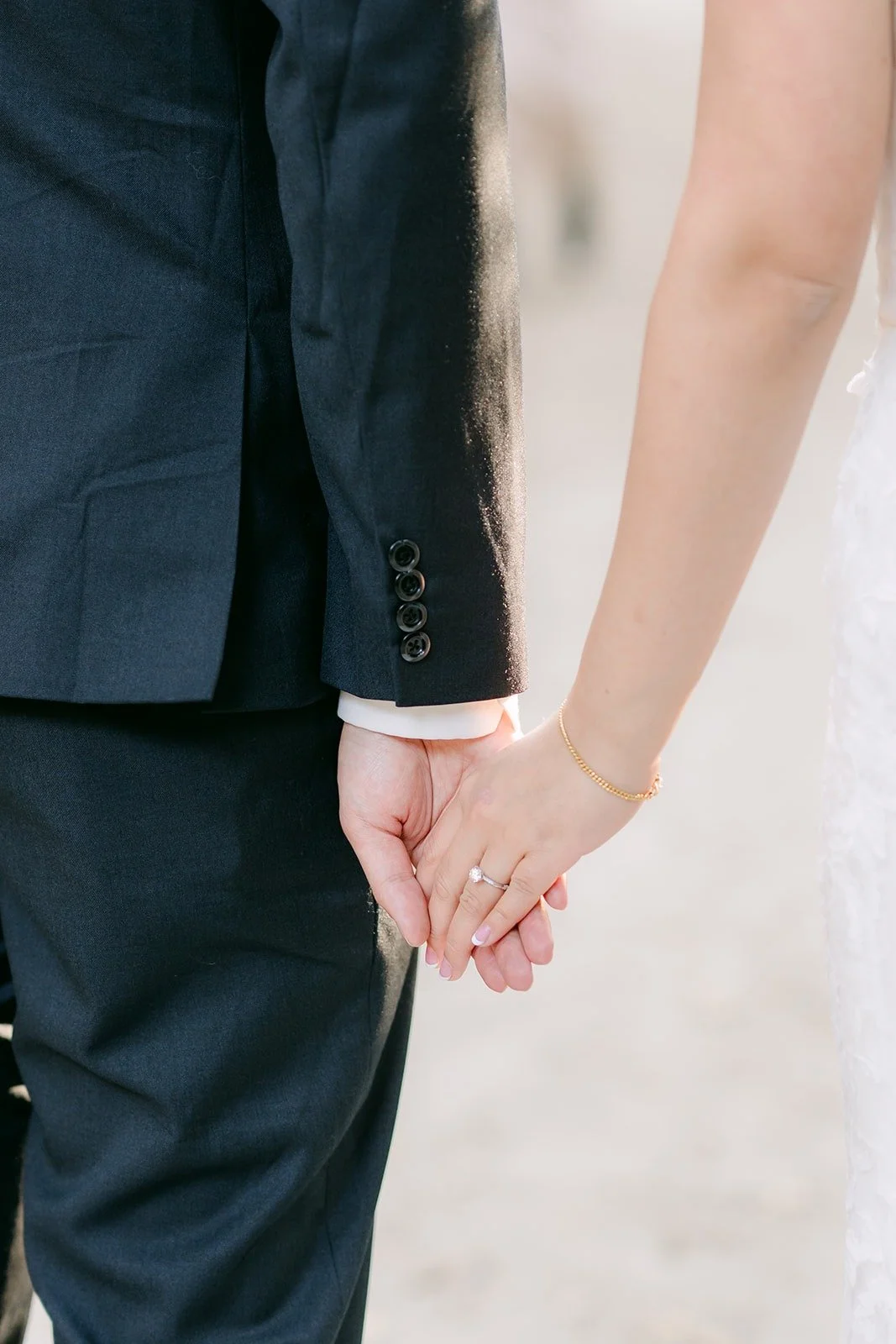Close detail of Shayna and Robert holding hands