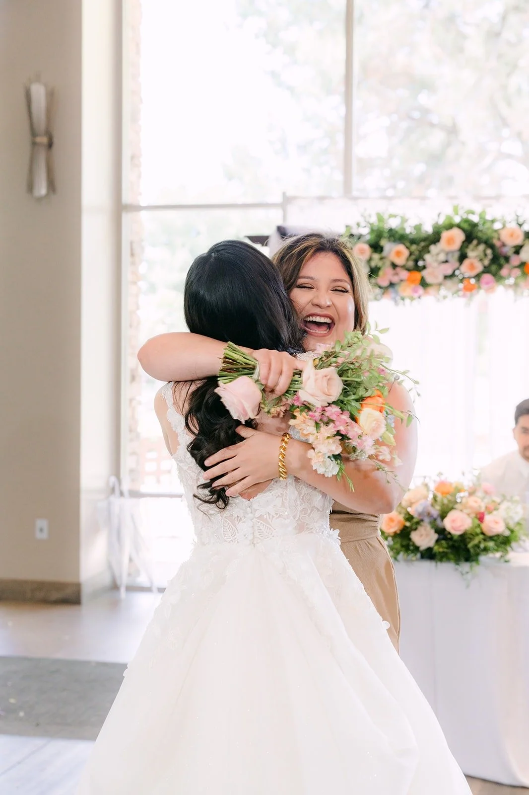 Natalie hugging the guest who caught her bouquet, photographed by One and Only Production