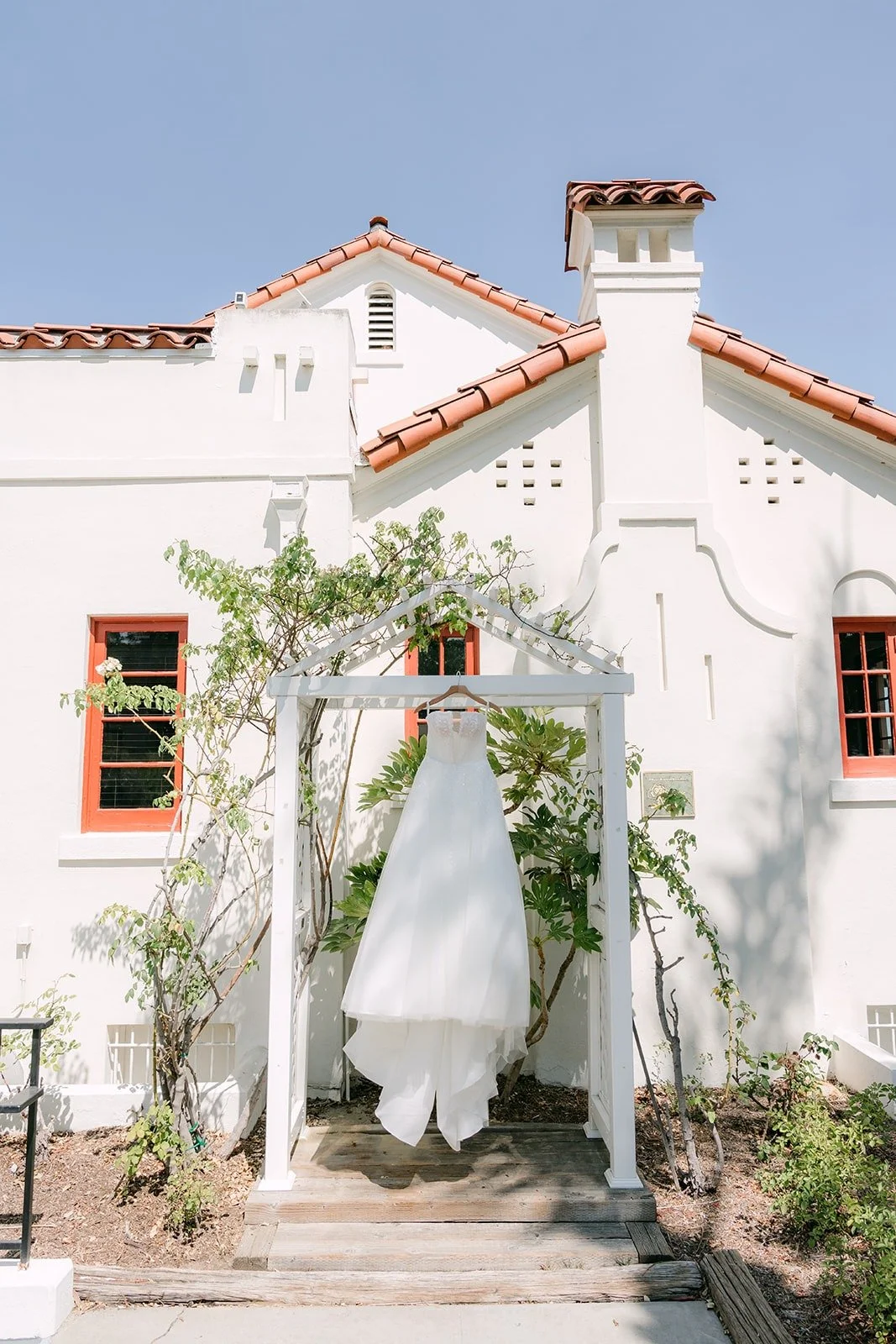 Amy's gown hanging in the arched entry at the Muckenthaler Cultural Center