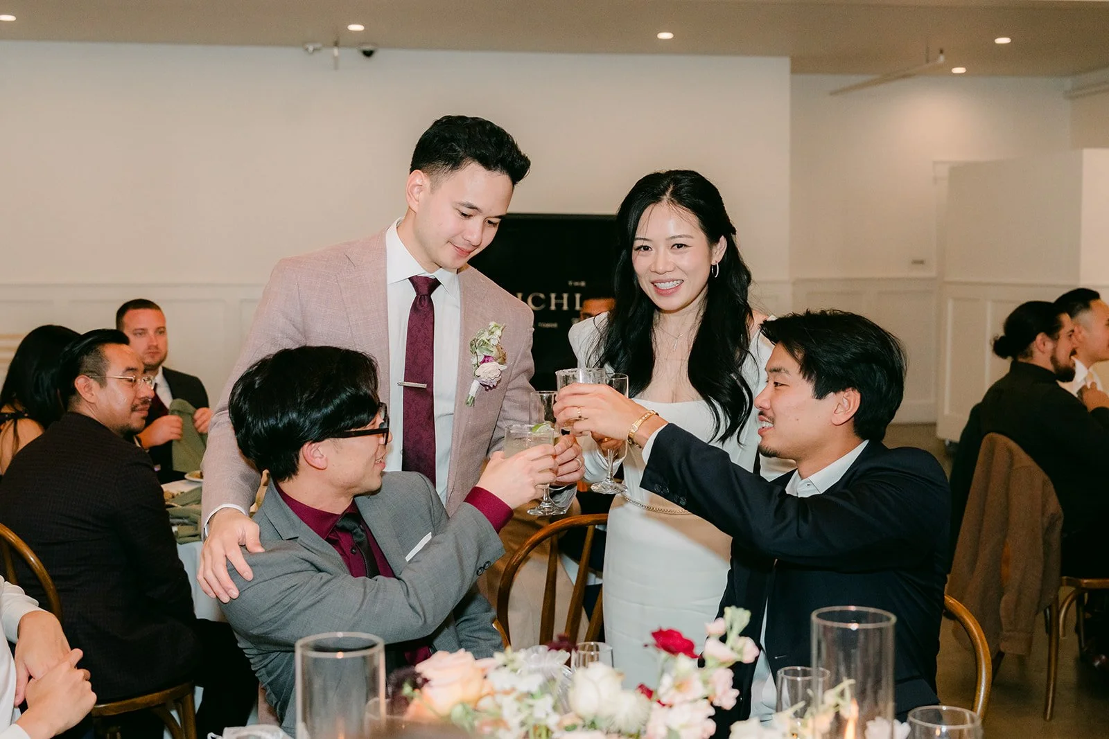 Michael toasting with a table during table visits.