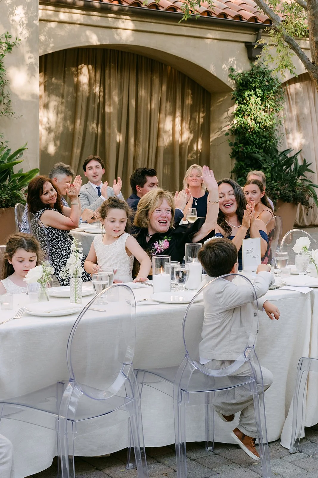 Guests cheering at their tables during the grand entrance