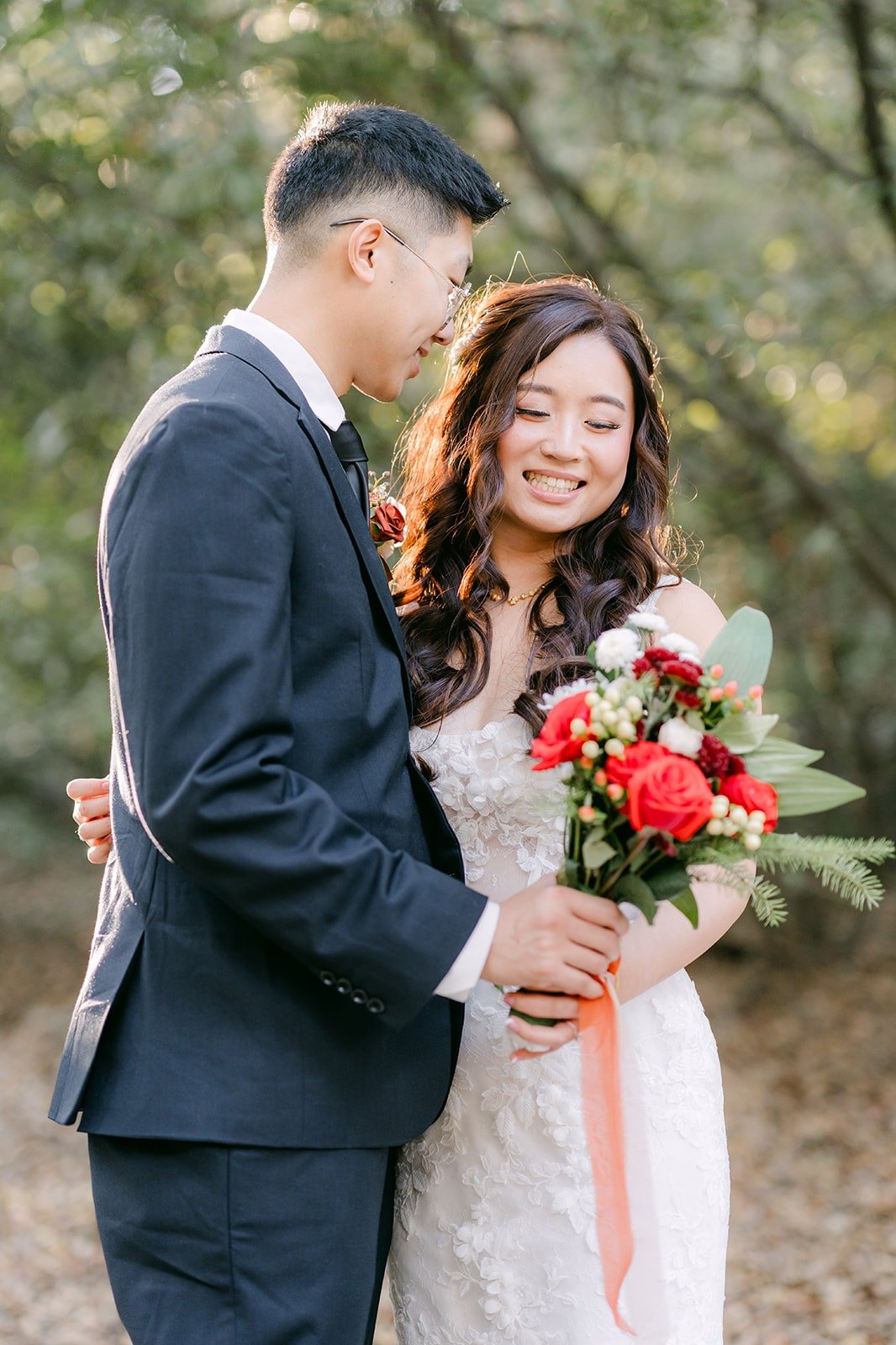 Shayna smiles as Robert pulls her close in the oak woodland at Oak Canyon Nature Center