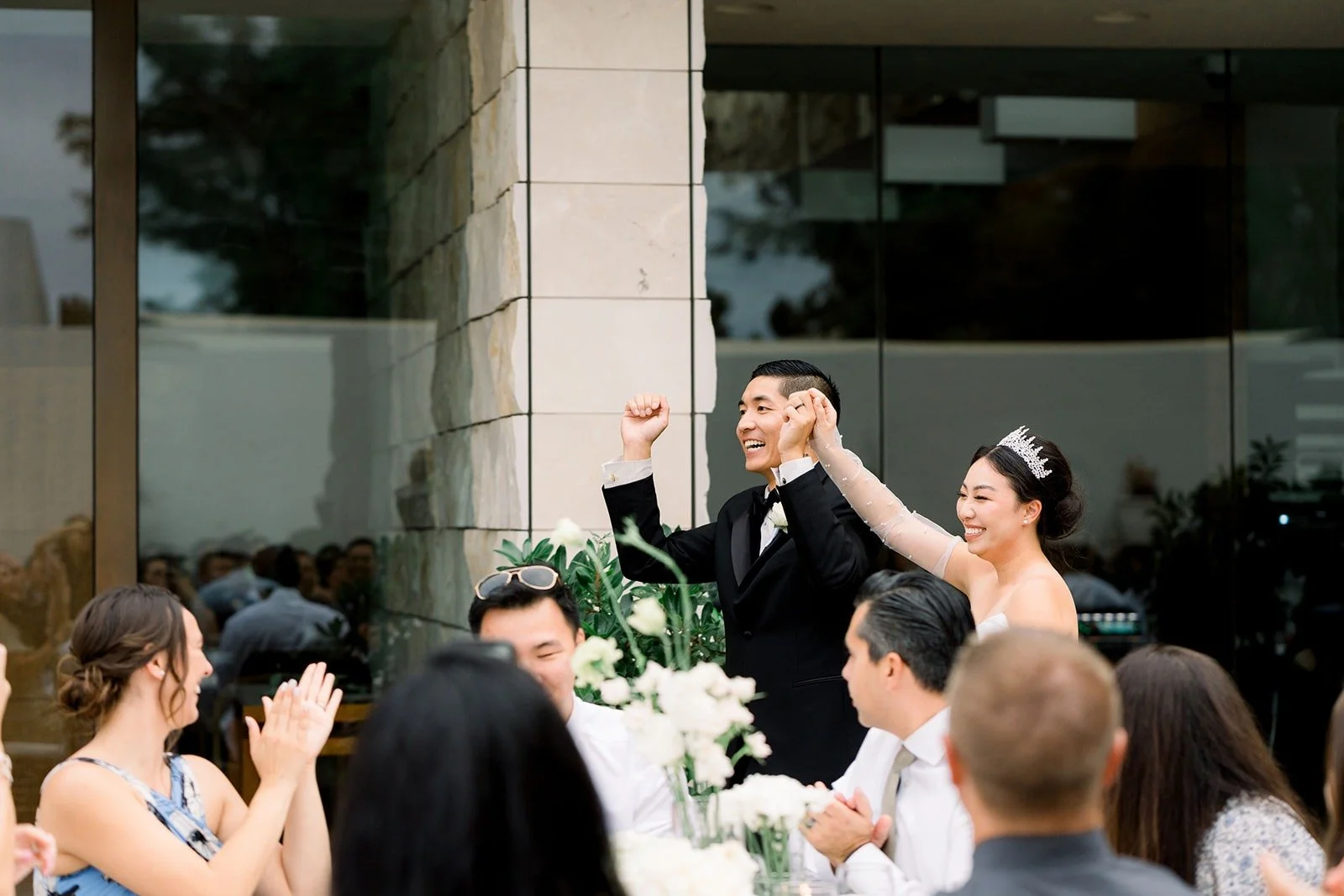 Steven and Jacinda wave to guests during their entrance